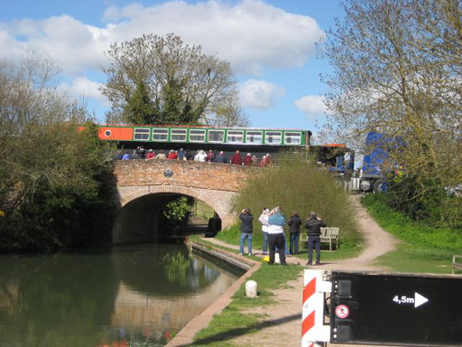 Narrowboat being transported over a canal bridge